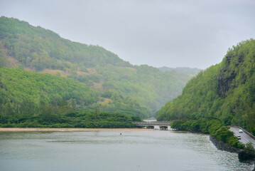 Baie Du Cap Maconde Viewpoint &ndash; a stunning coastal lookout perched atop a rocky cliff, offering breathtaking panoramic views of the Indian Ocean along a scenic curved road in Mauritius