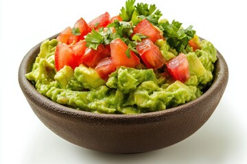 Creamy guacamole brimming in a rustic bowl with fresh red tomato and aromatic cilantro against clean white background
