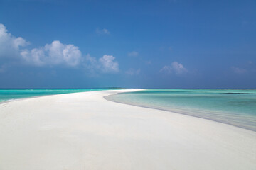 Tropical white sand beach with turquoise water, on an atoll in the Maldives, Indian Ocean