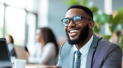 Fototapeta premium Happy business man listening to a discussion in an office 