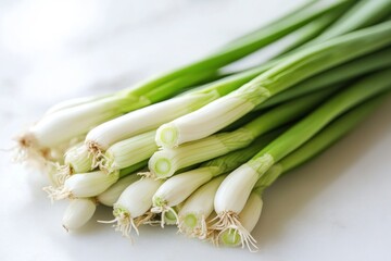 Fresh green onion bunch closeup on white marble surface healthy eating ingredient in food preparation