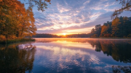 Serene Autumn Sunrise over Lake with Reflections in Calm Water.