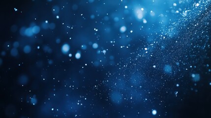 Obraz premium Elegant Abstract Blue Bokeh Background with Sparkling Particles and Soft Blur.
