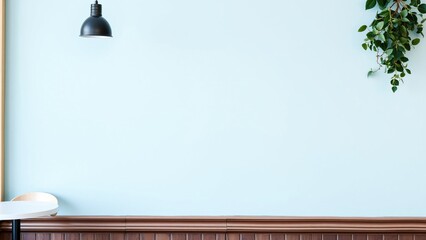 Minimalist Light Blue Wall Background with Hanging Plant and Pendant Light