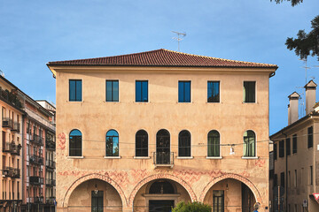 historic italian building with arched portico and warm facade in Treviso