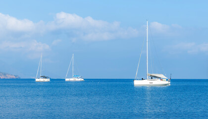 sailing yacht boats with white sails in blue sea . Luxury yachts Regata.Sailing in the wind through the waves at the Sea