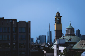 contrast between historic and modern architecture in the city skyline in Milano