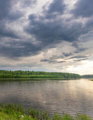 Lake with a cloudy sky in the background