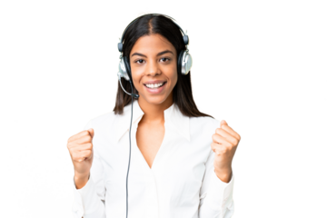 Telemarketer African American woman working with a headset over isolated chroma key background celebrating a victory in winner position