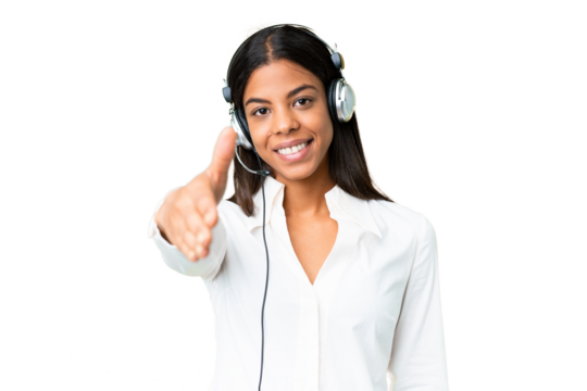 Telemarketer African American woman working with a headset over isolated chroma key background shaking hands for closing a good deal
