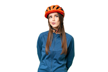 Young cyclist woman over isolated chroma key background and looking up