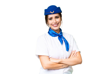 Airplane stewardess over isolated chroma key background with arms crossed and looking forward