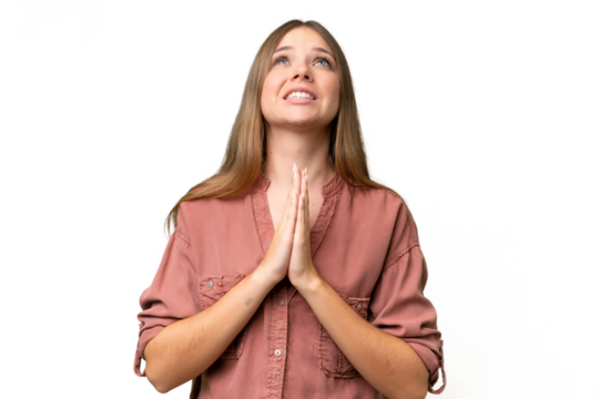 Young beautiful blonde woman over isolated background keeps palm together. Person asks for something