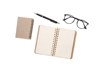An open spiral-bound notebook with lined pages, a smaller wooden notebook, black-rimmed glasses, and a sleek black pen, arranged in a minimalist workspace setting, isolated on a transparent background