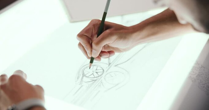 Drawing, sketch and hands with design for car, vehicle and automobile prototype at night in studio. Creative designer, artist and person with blueprint, ideas or illustration for automotive structure