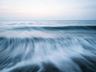 Obraz premium Serene Ocean Waves Crashing on the Shore, Symbolizing Tranquility and Serenity. Ideal for Relaxation, Meditation, and Travel Websites.
