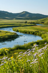Serene River Flowing Through Lush Meadows Under Clear Blue Sky with Vibrant Wildflowers
