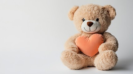 Plush teddy bear holding heart.