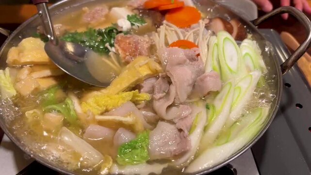 "Chanko nabe" is a Japanese hot pot with vegetables, meat, tofu, and rice, often eaten by sumo wrestlers.