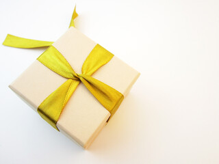 yellow gift box with ribbon