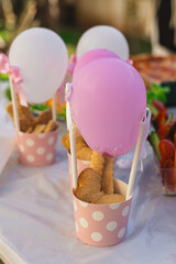 Delightful party decorations featuring sweet treats and colorful balloons
