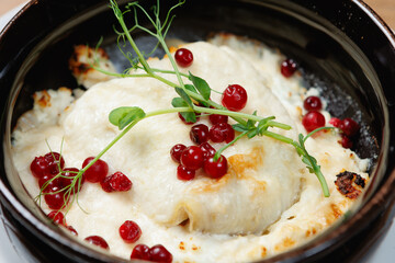 This luxurious cheese dish topped with fresh berries and herbs is perfect for exquisite gourmet dining
