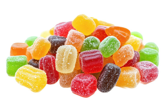 A colorful pile of assorted gummy candies scattered on a white surface in a studio photography shot