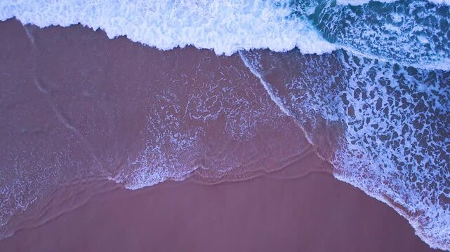 Aerial view at sunset of the waves on the beach of Antuerta in Ajo in the Bareyo Municipality. Trasmiera Coast. Cantabrian Sea. Cantabria. Spain. Europe