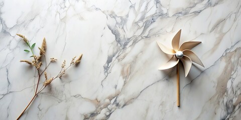 Obraz premium Symmetrical Above-Shot of Natural Wind Design on Marble Surface with Organic Elements for Copy Space, Ideal for Minimalist and Modern Aesthetic in Portrait Photography