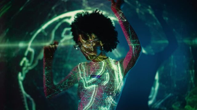 Stylish African American woman dances against futuristic background, music video