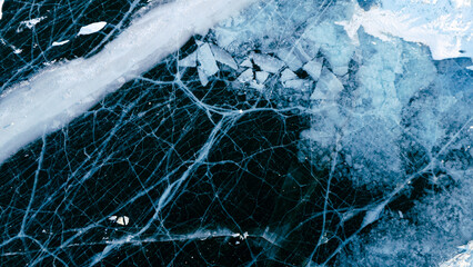A mesmerizing aerial view of Lake Baikal's icy surface, showcasing intricate patterns and textures of the frozen landscape.