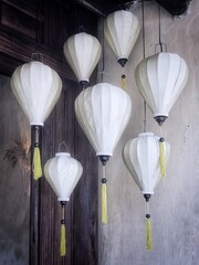 White silk Vietnamese bamboo lanterns, decorated room corner.