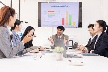 Group of business people working together with dashboard analysis and data management a meeting table in an office.