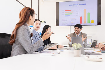Group of business people working together with dashboard analysis and data management a meeting table in an office.