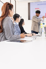 Obraz premium Group of business people working together with dashboard analysis and data management a meeting table in an office.