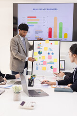 Group of business people working together with dashboard analysis and data management a meeting table in an office.