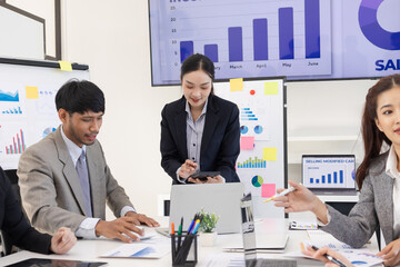 Group of business people working together with dashboard analysis and data management a meeting table in office.