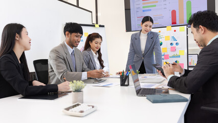 Group of business people working together with dashboard analysis and data management a meeting table in office.