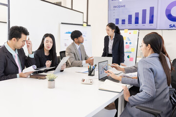 Group of business people working together with dashboard analysis and data management a meeting table in office.