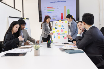 Group of business people working together with dashboard analysis and data management a meeting table in office.