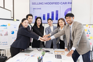 Happy excited asian business people teamwork brainstorm in modern office, successful start and good...