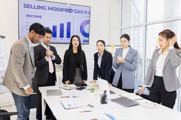 Group of business people working together with dashboard analysis and data management a meeting table in an office.
