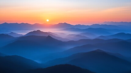 Fototapeta premium Sunrise over misty mountain range. (1)