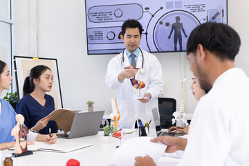 Fototapeta premium Group of Asian doctor working together and brainstorm at the clinic, Healthcare and medical meeting concept.