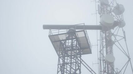 Marine radar on the shore. View of rotating radar in a snowstorm. 