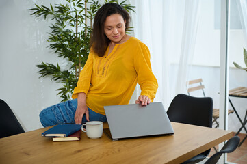 Confident Businesswoman Working Remotely in a Cozy Home Office Environment