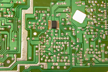 Close-up of a circuit board with microcircuits from an electrical appliance or computer. Selective...