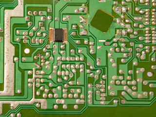 Close-up of a circuit board with microcircuits from an electrical appliance or computer. Selective...