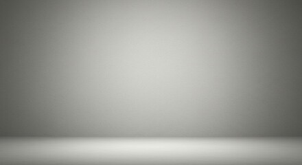 A minimalistic gray backdrop with subtle lighting, ideal for presentations or product displays.