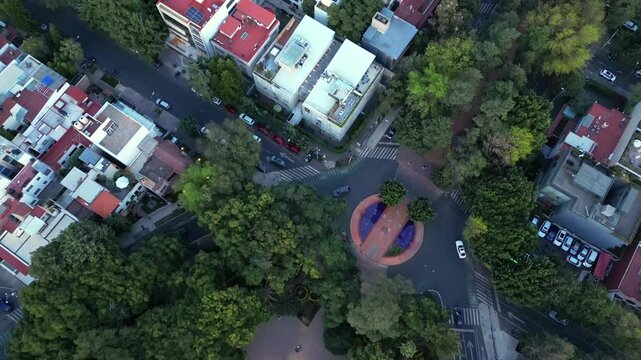 Top down aerial shot of buildings and green square in Mexico City. Mexico.